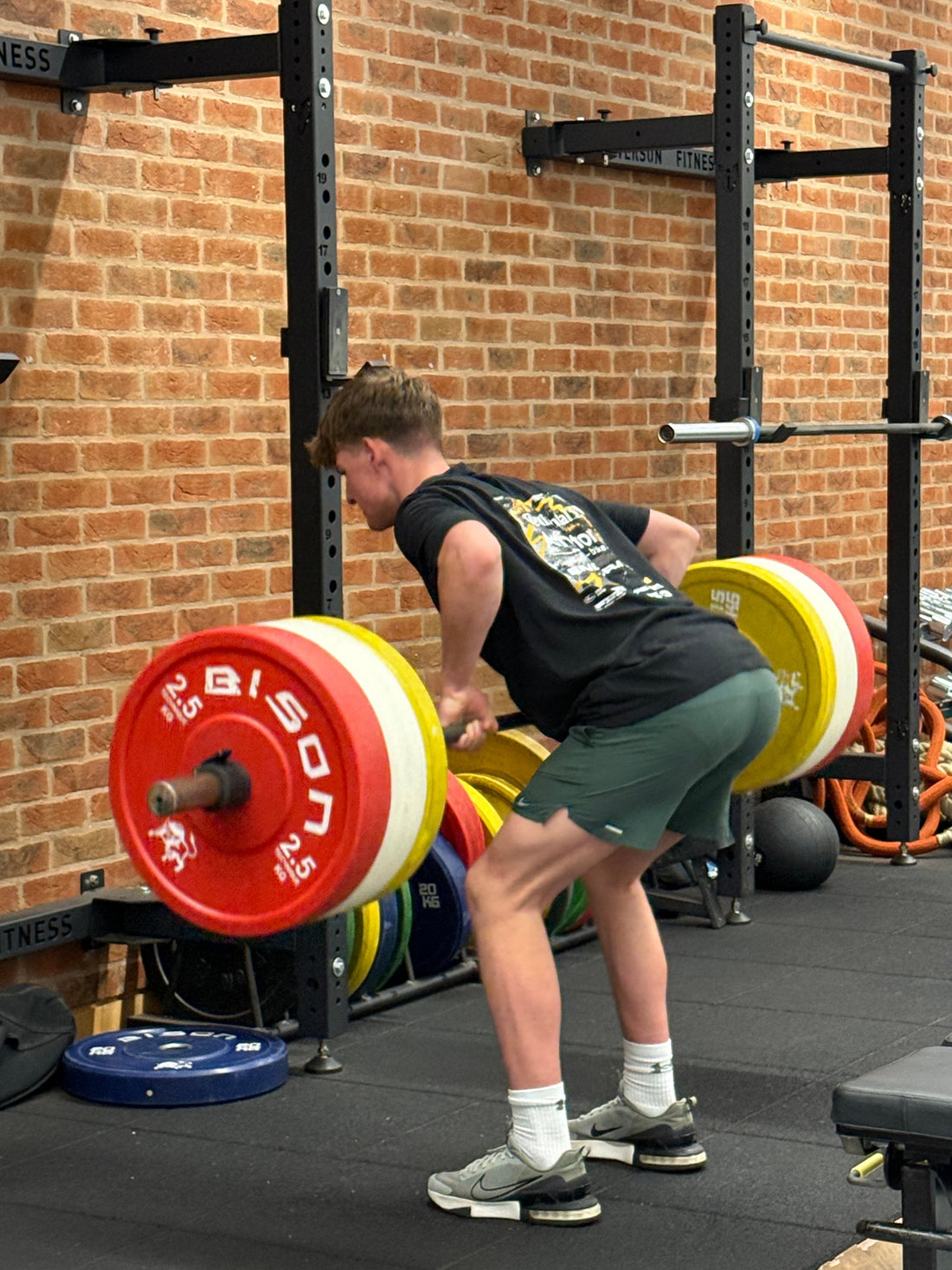 Athlete performing a bent over row in a high performance gym for Milway performance 